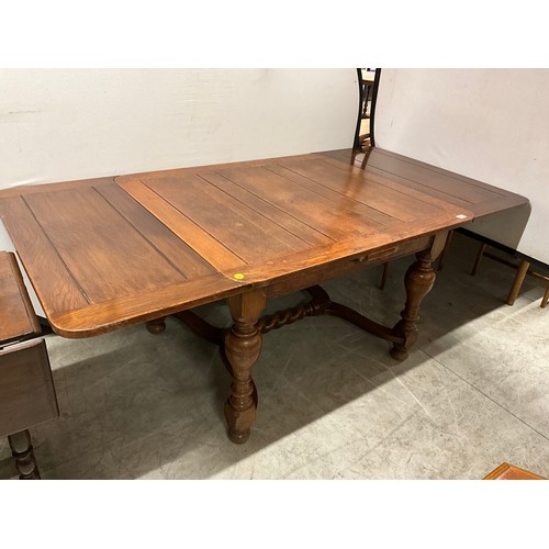 434 - VINTAGE OAK DRAWER LEAF DINING TABLE ON TURNED AND STRETCHERED BASE H29