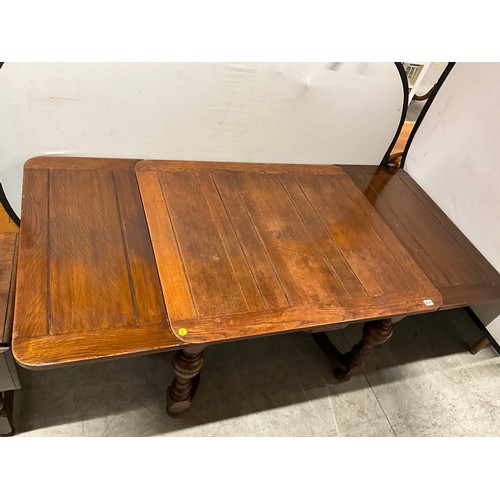 434 - VINTAGE OAK DRAWER LEAF DINING TABLE ON TURNED AND STRETCHERED BASE H29