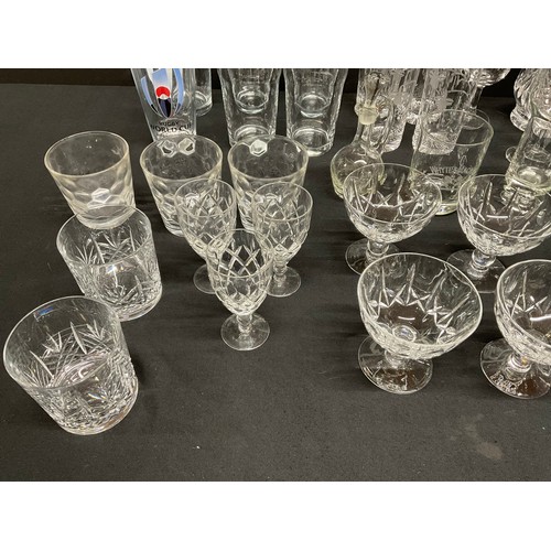 20A - THREE BOXES OF GLASSWARE TO INCLUDE DECANTERS, FRUIT BOWLS, VASES, WATER JUGS, DRINKING GLASSES ETC