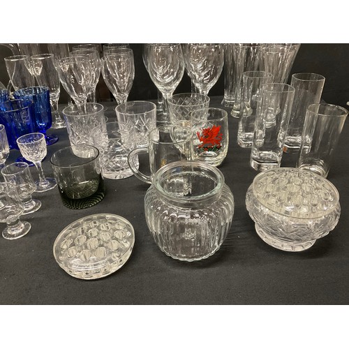 20A - THREE BOXES OF GLASSWARE TO INCLUDE DECANTERS, FRUIT BOWLS, VASES, WATER JUGS, DRINKING GLASSES ETC