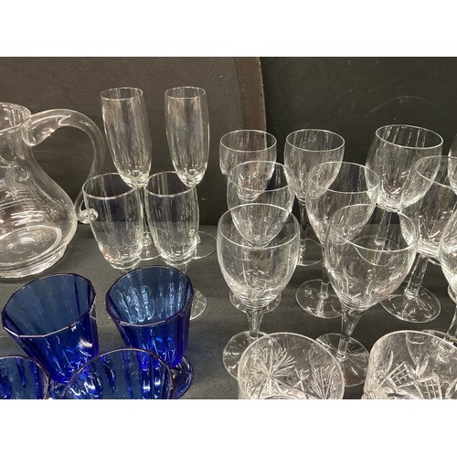 20A - THREE BOXES OF GLASSWARE TO INCLUDE DECANTERS, FRUIT BOWLS, VASES, WATER JUGS, DRINKING GLASSES ETC