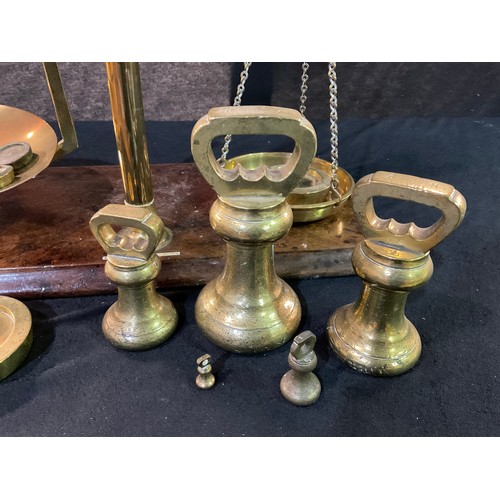 41 - VICTORIAN BRASS BALANCE SCALES AND WEIGHTS ON MAHOGANY PLINTH