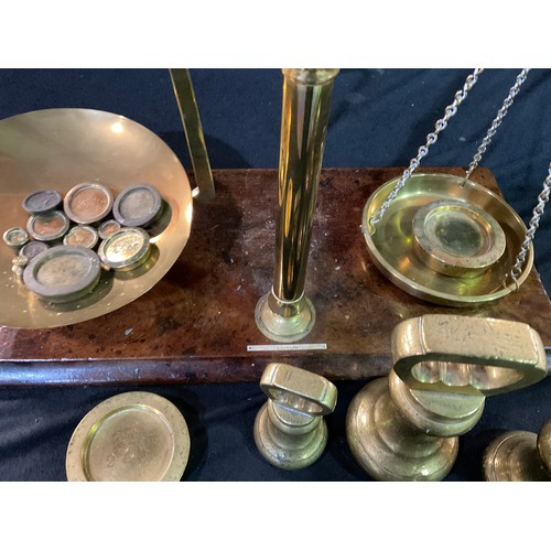 41 - VICTORIAN BRASS BALANCE SCALES AND WEIGHTS ON MAHOGANY PLINTH