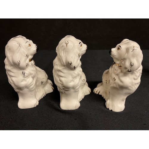 60 - THREE BESWICK MINATURE STAFFS DOGS AND TWO EARLY VICTORIAN STAFFORDSHIRE HUNTING HOUNDS WITH RABBITS... 