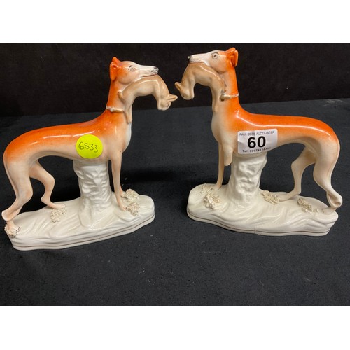 60 - THREE BESWICK MINATURE STAFFS DOGS AND TWO EARLY VICTORIAN STAFFORDSHIRE HUNTING HOUNDS WITH RABBITS... 