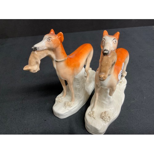 60 - THREE BESWICK MINATURE STAFFS DOGS AND TWO EARLY VICTORIAN STAFFORDSHIRE HUNTING HOUNDS WITH RABBITS... 