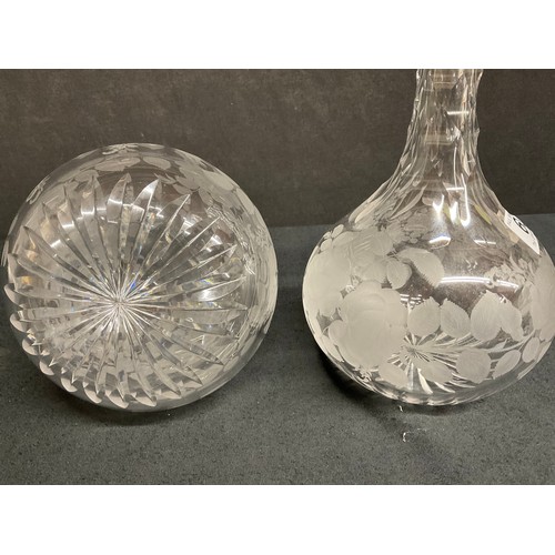 65 - A PAIR OF ETCHED GLASS DECANTERS DECORATED WITH FRUIT AND FOILLAGE