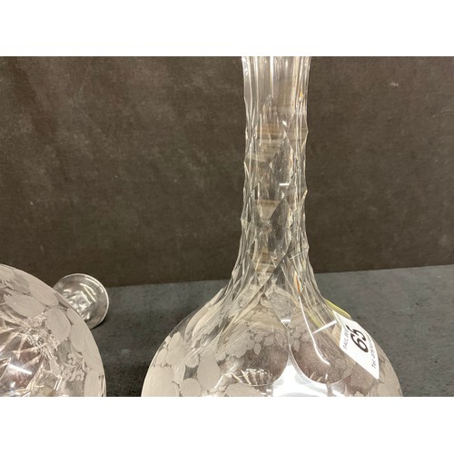 65 - A PAIR OF ETCHED GLASS DECANTERS DECORATED WITH FRUIT AND FOILLAGE