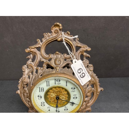 69 - A DECORATIVE BRASS MANTLE CLOCK H11