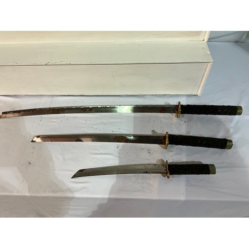 94 - SET OF THREE REPRODUCTION JAPANESE SWORDS - AS FOUND