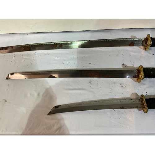 94 - SET OF THREE REPRODUCTION JAPANESE SWORDS - AS FOUND