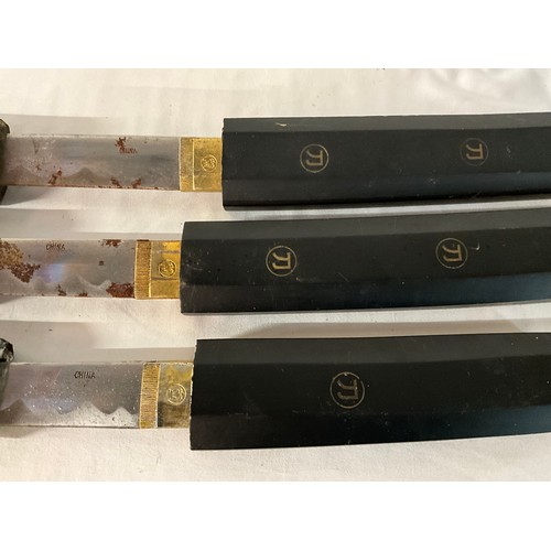 98 - THREE REPRODUCTION JAPANESE SWORDS