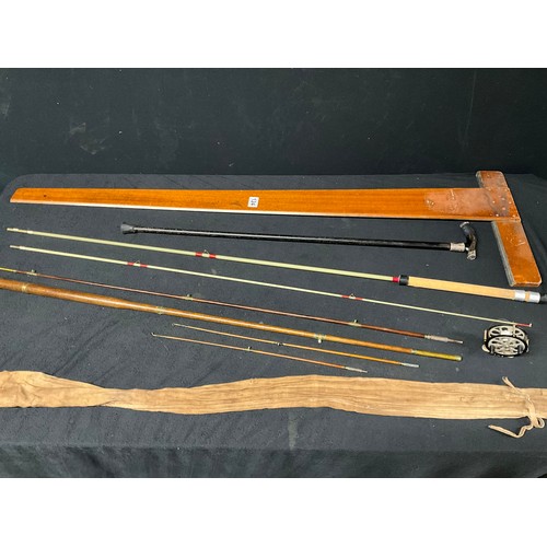 124 - TWO VINTAGE FISHING RODS TO INCLUDE A WALBRAN VINTAGE EXAMPLE, A CENTRE PIN REEL, A HALLMARKED SILVE... 