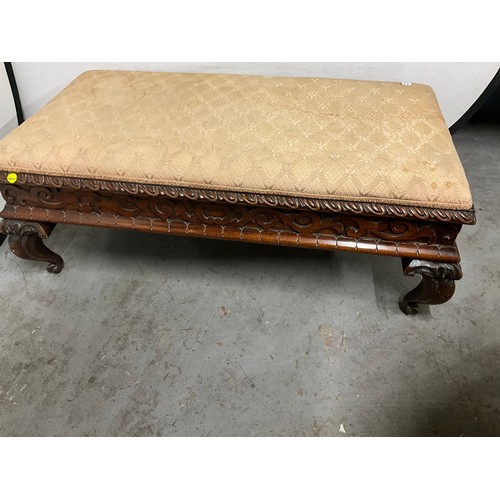 417 - DECORATIVE HEAVILY CARVED MAHOGANY LARGE FOOTSTOOL WITH UPHOLSTERED TOP H19” W49” D26”