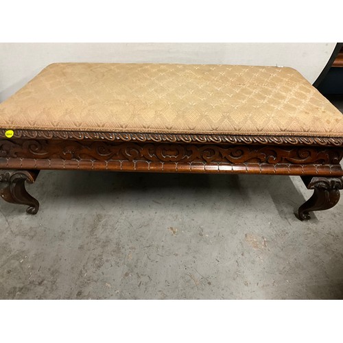 417 - DECORATIVE HEAVILY CARVED MAHOGANY LARGE FOOTSTOOL WITH UPHOLSTERED TOP H19” W49” D26”