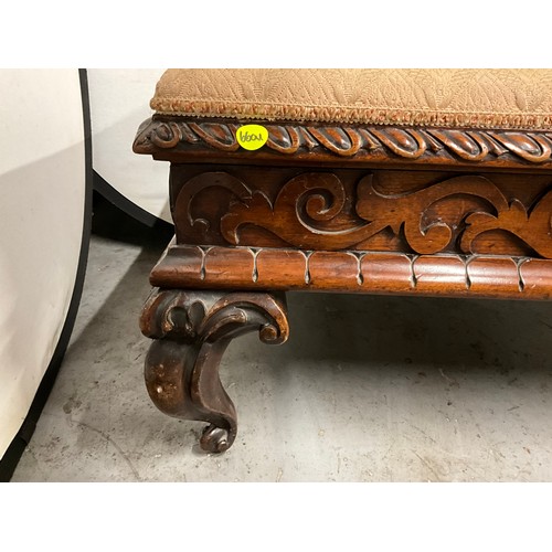 417 - DECORATIVE HEAVILY CARVED MAHOGANY LARGE FOOTSTOOL WITH UPHOLSTERED TOP H19” W49” D26”