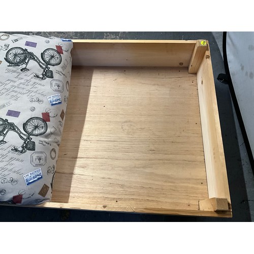 426 - LARGE WOODEN DOG BED COMPLETE WITH CUSHION H13” W50” D32”