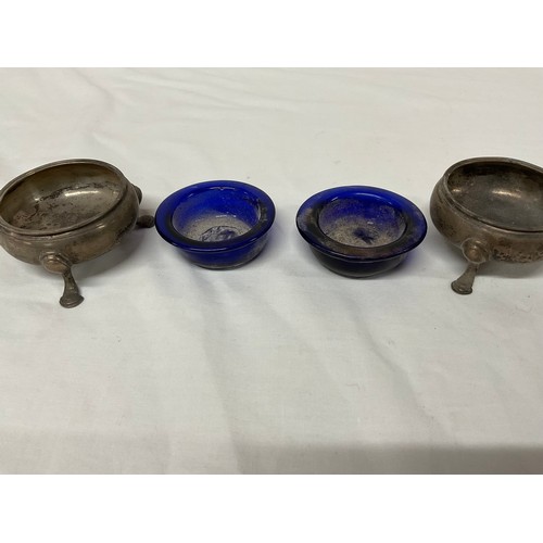 64 - HALLMARKED SILVER MARSTARD POT AND PAIR OF BLUE LINED SALTS COMPLETE WITH THERE SPOONS