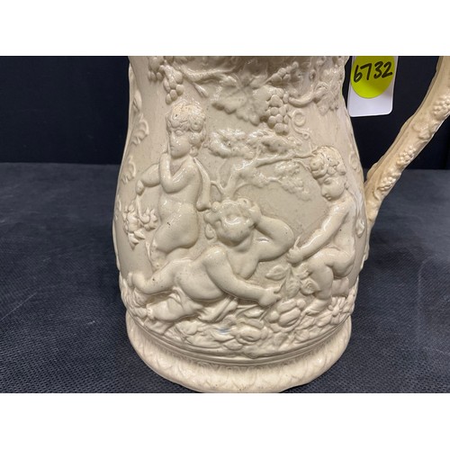 76 - EARLY VICTORIAN CREAMWARE JUG DECORATED WITH CHERUBS AND FOLIGE H8