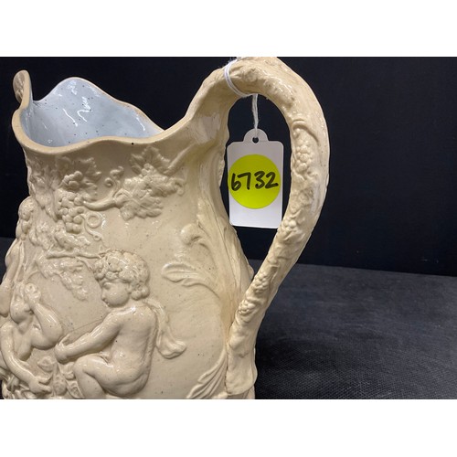 76 - EARLY VICTORIAN CREAMWARE JUG DECORATED WITH CHERUBS AND FOLIGE H8