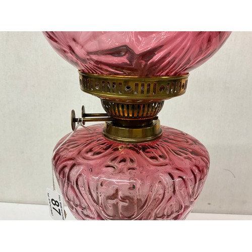 87 - VICTORIAN BRASS CORINTHAIN COLUMN OIL LAMP WITH RED GLASS BOWL AND SHADE COMPLETE WITH CHIMMNEY H26