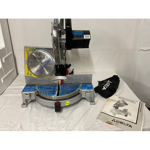 131 - COMPOUND ELECTRIC MITRE SAW WITH INSTRUCTIONS AND SPARE BLADE