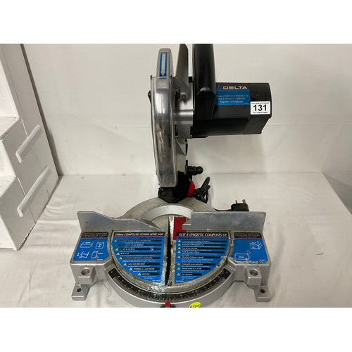 131 - COMPOUND ELECTRIC MITRE SAW WITH INSTRUCTIONS AND SPARE BLADE