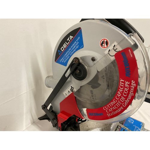 131 - COMPOUND ELECTRIC MITRE SAW WITH INSTRUCTIONS AND SPARE BLADE