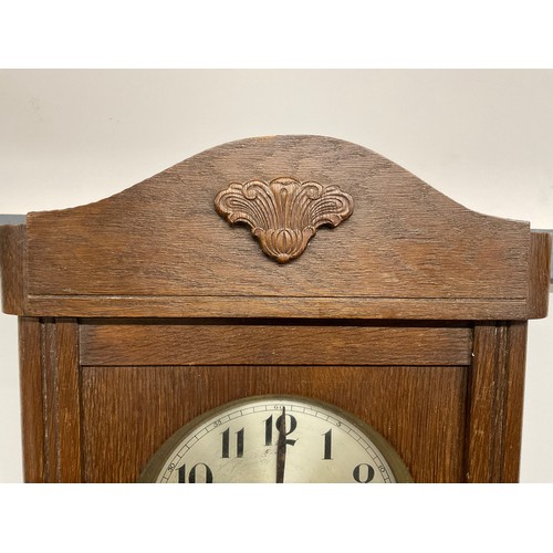 149 - VINTAGE OAK CASED WALL CLOCK COMPLETE WITH KEY AND PENDULUM H 30