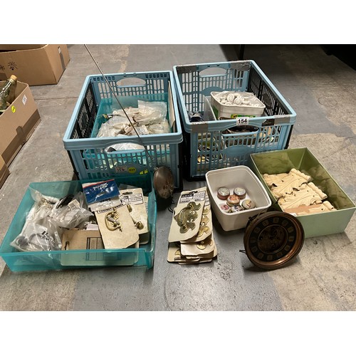 154 - TWO CRATES OF HANDLES, CLOCK PARTS ETC