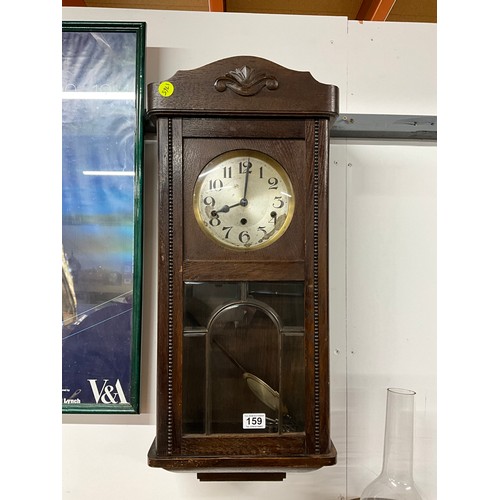 159 - VINTAGE OAK WALL CLOCK COMPLETE WITH KEY AND PENDULUM HEIGHT 30