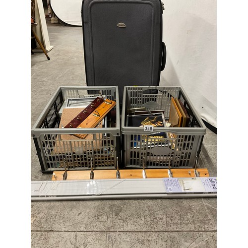 388 - TWO CRATES OF PICTURE FRAMES ETC AND A SUITCASE