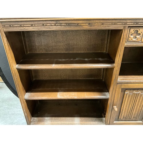 385 - VINTAGE OAK BOOKCASE PRIRARY STYLE WITH LINEN FOLD DESIGN TO DOOR H35