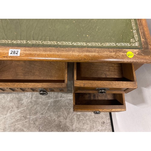 282 - VINTAGE OAK KNEEHOLE DESK WITH GREEN LEATHER INSET TOP H29