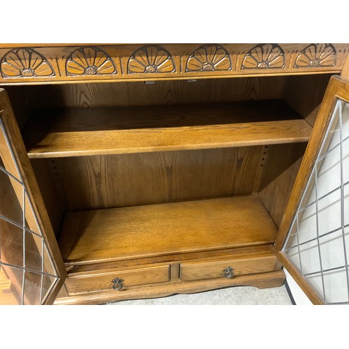 296 - VINTAGE OAK PRIORY STYLE LEADED GLASS BOOKCASE WITH 2 DOORS OVER 2 DRAWERS H41