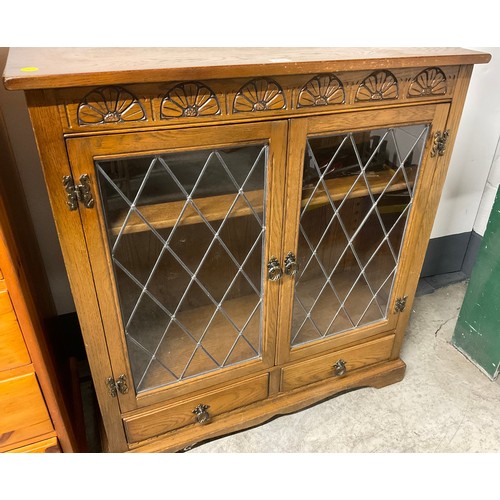 296 - VINTAGE OAK PRIORY STYLE LEADED GLASS BOOKCASE WITH 2 DOORS OVER 2 DRAWERS H41