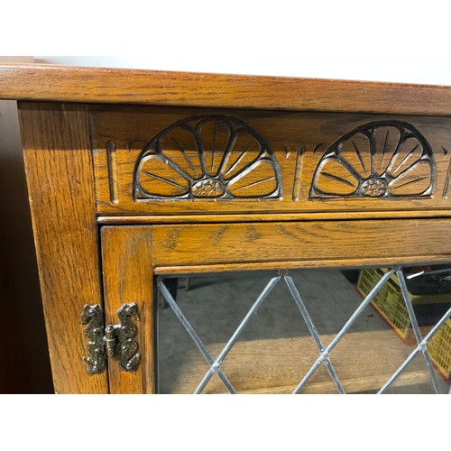 296 - VINTAGE OAK PRIORY STYLE LEADED GLASS BOOKCASE WITH 2 DOORS OVER 2 DRAWERS H41