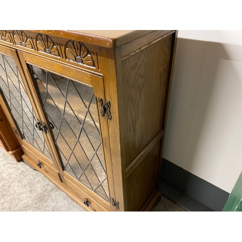 296 - VINTAGE OAK PRIORY STYLE LEADED GLASS BOOKCASE WITH 2 DOORS OVER 2 DRAWERS H41