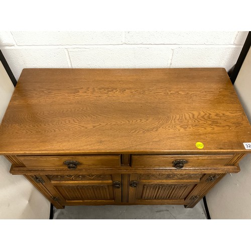 322 - VINTAGE OAK BADGED OLD CHARM SMALL SIDEBOARD WITH 2 DRAWERS OVER 2 DOORS WITH LINEN FOLD DECORATION ... 