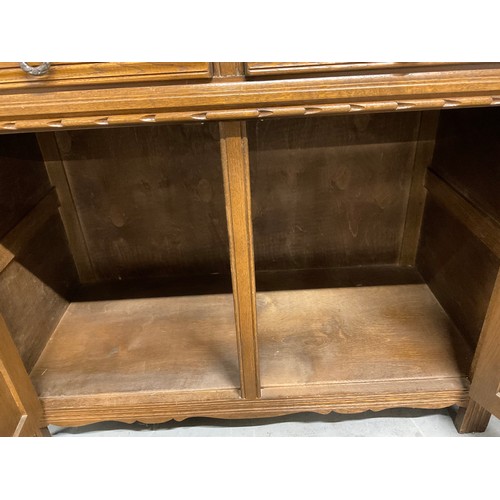 322 - VINTAGE OAK BADGED OLD CHARM SMALL SIDEBOARD WITH 2 DRAWERS OVER 2 DOORS WITH LINEN FOLD DECORATION ... 