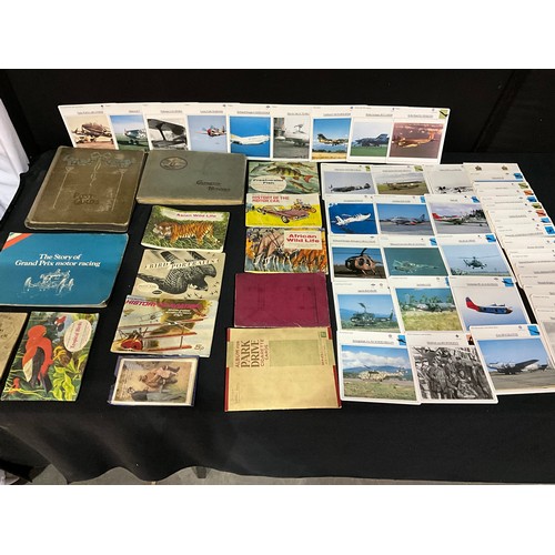 112 - QUANTITY OF POSTCARD AND CIGARETTE CARD ALBUMS, LOOSE POSTCARDS, AIRCRAFT PICTURES AND THE STORY OF ... 