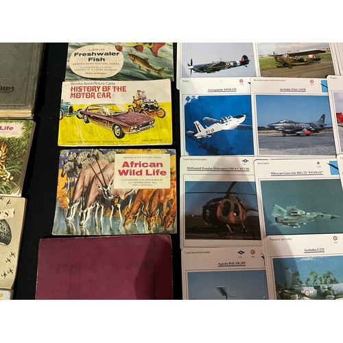 112 - QUANTITY OF POSTCARD AND CIGARETTE CARD ALBUMS, LOOSE POSTCARDS, AIRCRAFT PICTURES AND THE STORY OF ... 