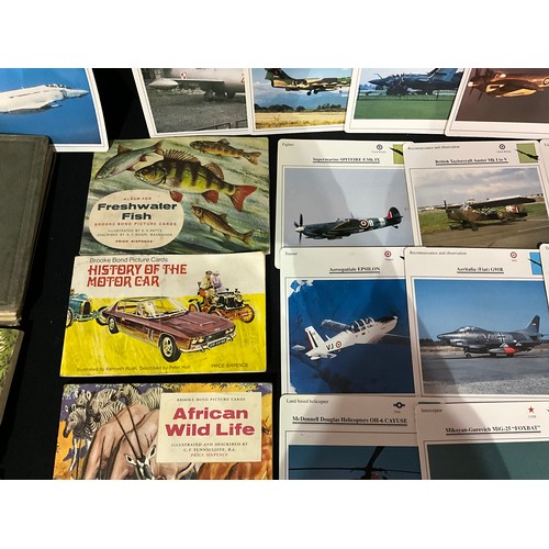 112 - QUANTITY OF POSTCARD AND CIGARETTE CARD ALBUMS, LOOSE POSTCARDS, AIRCRAFT PICTURES AND THE STORY OF ... 