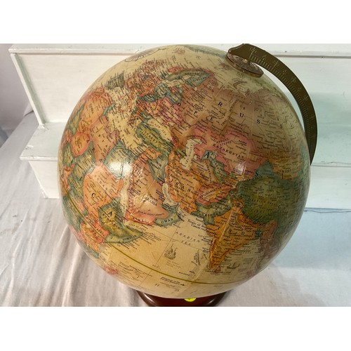 219 - VINTAGE WORLD GLOBE ON A WOODEN BASE H17” D12”