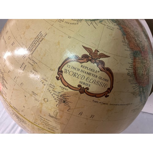 219 - VINTAGE WORLD GLOBE ON A WOODEN BASE H17” D12”