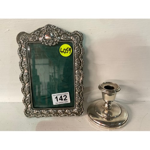 142 - HALLMARKED SILVER DWARF CANDLESTICK AND PHOTO FRAME