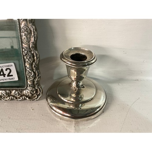 142 - HALLMARKED SILVER DWARF CANDLESTICK AND PHOTO FRAME