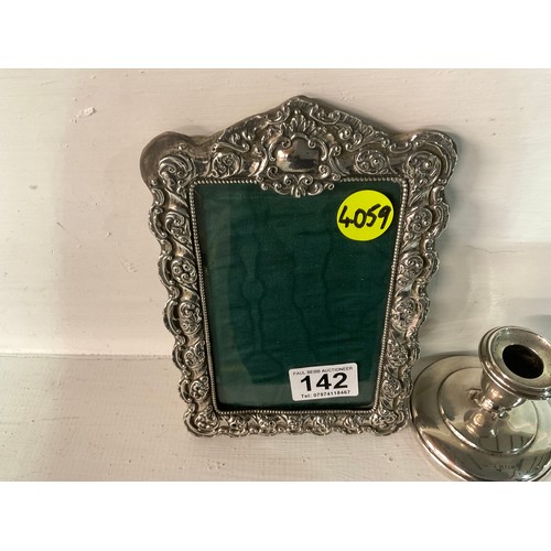 142 - HALLMARKED SILVER DWARF CANDLESTICK AND PHOTO FRAME