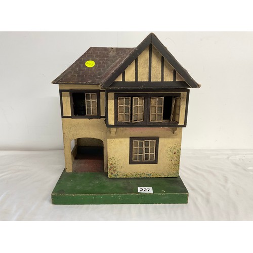 227 - VINTAGE WOODEN DOLLS HOUSE COMPLETE WITH FIGURES AND FURNITURE