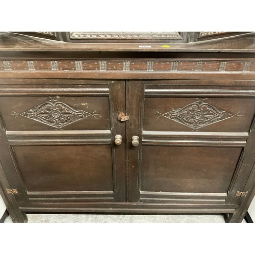 307 - DARK OAK CARVED COURT CUPBOARD  H54